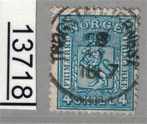 Nk 14 o. Noe uryddig fullstemplet "TRØGSTAD JERNBANEST. 1867". GI BUD!