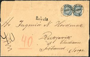 40 II. 40 øres porto til Island. 20 øre blå 1883 i horisontalt par på konvolutt til Reykjavik, stemplet ""Chriatiania 25.8.84". Ved ankomst er konvolutten stemplet "Rebuts" og sendt i retur. Baksiden med dansk stempel samt "Akureyri 5.10". Konvolutten med noen anmerkninger som ikke berører merkene.