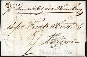 Komplett brev, datert "Christiania 15. sep 1934" og sendt til London. Påskrevet "Dampskibet via Hamburg" og stemplet "Hamburg 23 Sep 1834" på forsiden. Ankomststemplet "Se 27 1834" på baksiden. To vertikale arkivbretter