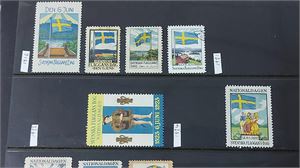 CINDERELLAS två välfyllda visiralbum med diverse välgörenhetsmärken julmärken,  propagandamärken
