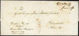 Brevomslag, sendt portofritt, med håndskrevet stedsnavn "Lyngdal 12/10" og sendt til Holmesland i Sogn. Omslaget er brukt en gang før, og ble da transittstemplet "Christianssand".