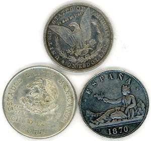 Three coins in silver: 5 Pesetas Spain 1870, US dollar 1887 and 5 Pesos Mexico 1953. VK