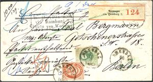 27,32. 120 øres porto til Tyskland. 20 øre skravert Posthorn og 1 kr Oscar på konvolutt brukt som følgebrev til Berlin, stemplet "Arendal 25.6.1880". Flere postale påskrifter samt stempel "Aus (über) Dänemark via Hamburg 2/Porto von Woÿens". Baksiden med tre strempler. Bl.a. "Hamburg" og ankomststempel.